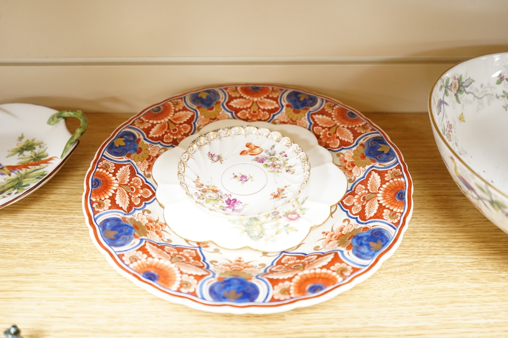A collection of porcelain and pottery to include commemorative china, a leaf dish and group of wade figures, largest 29cm in diameter